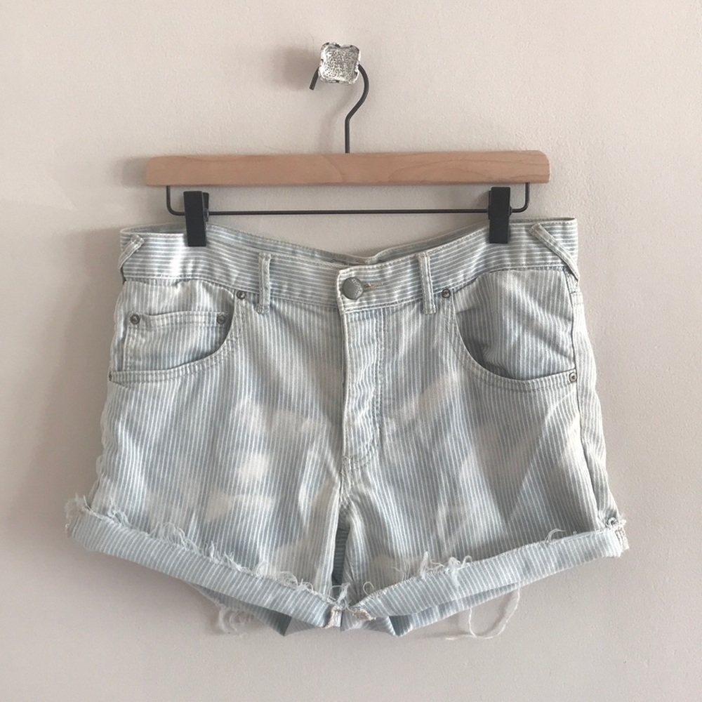 Free people light wash distressed denim shorts